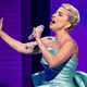 Lady Gaga sings onstage.